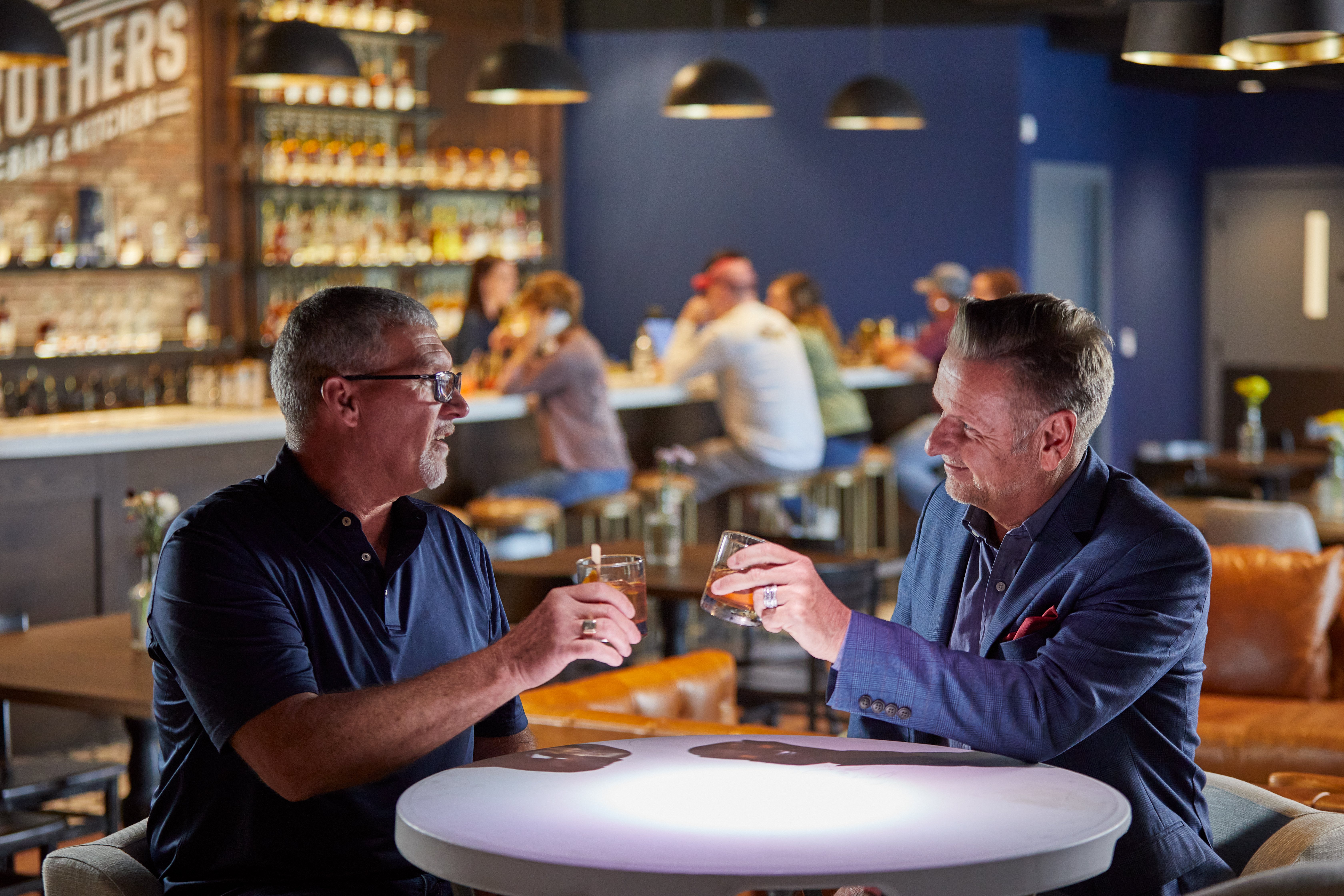 Two men eating at Five Brothers Bar & Kitchen
