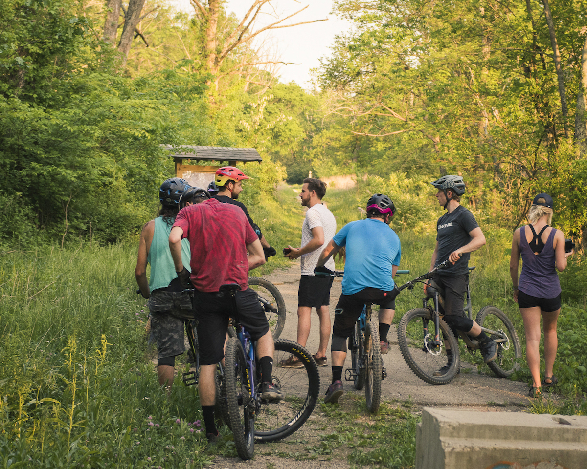 Group of mountain bikers looking at trail map in Northern KY