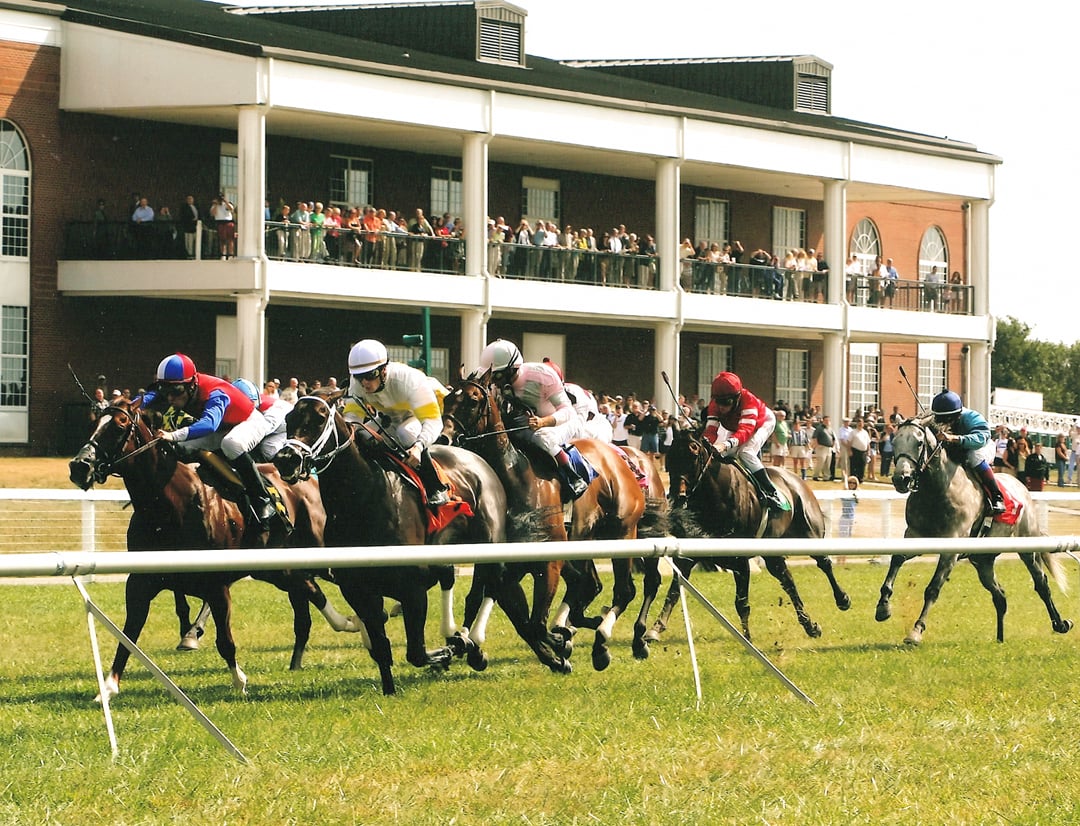 Thoroughbred racing at Kentucky Downs racetrack in Franklin, Kentucky.